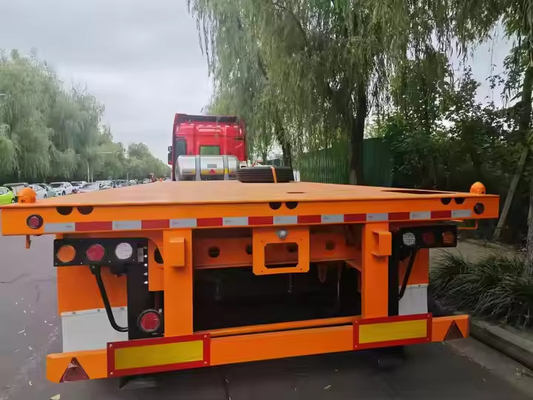 Double Axles Tekstur Besi Panjang Dari 10m sampai 20m Heavy Duty Low Flatbed Transport Truck Semi Trailer